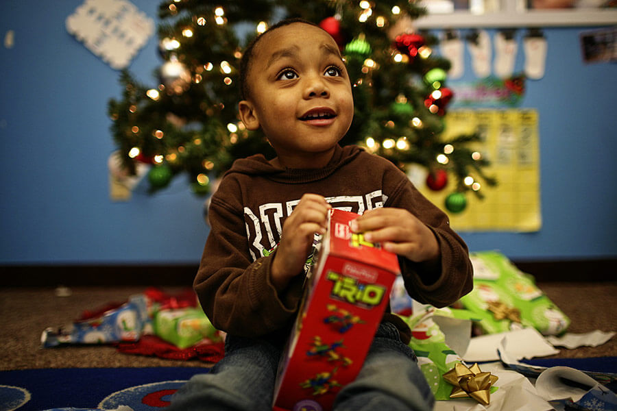 Child opening Christmas gift