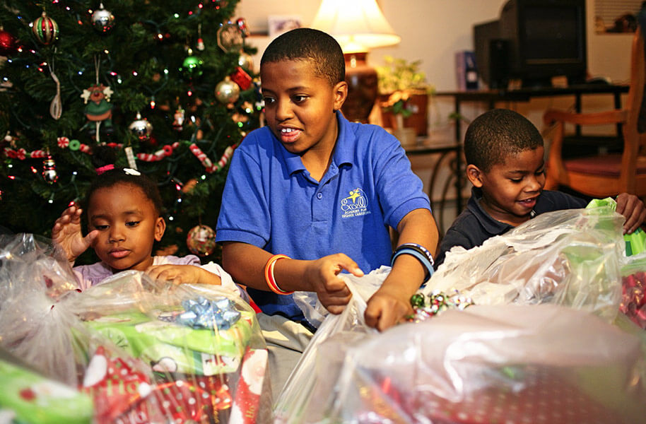 Children receiving Christmas gifts